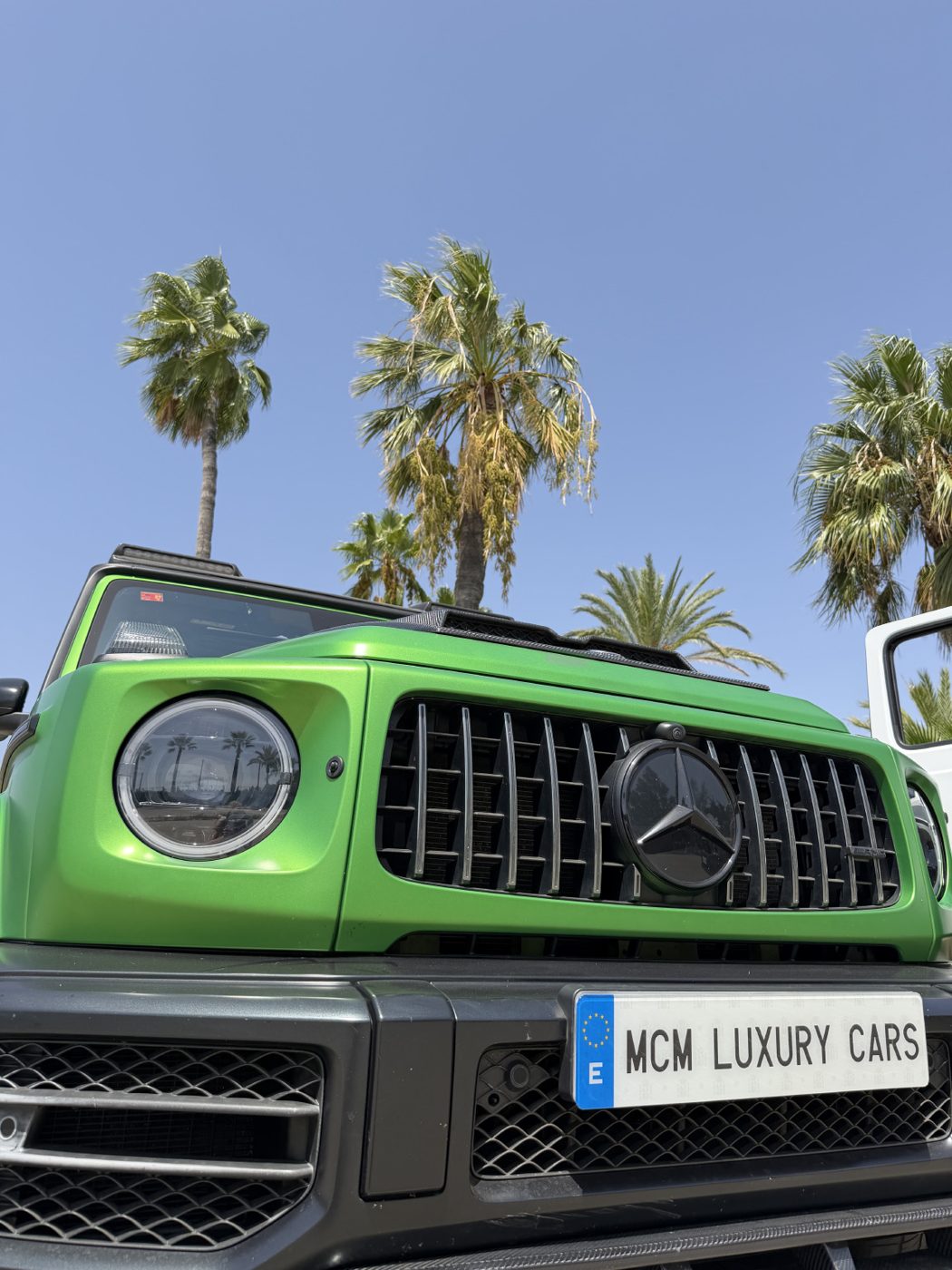 Green G 63 grille with MCM Luxury Cars plate